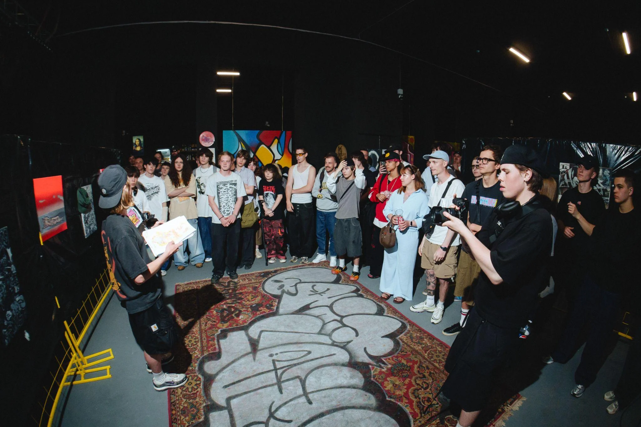 Viewers around the central floor work