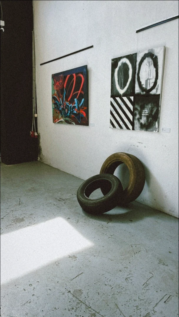 Artworks and old tyres in the B-Walls exhibition space